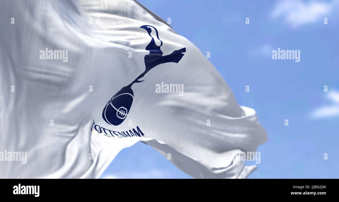 London, UK, May 2022: The flag of Tottenham Hotspur Club waving in the wind on a clear day. Tottenham Hotspur is a professional football club based in Stock Photo