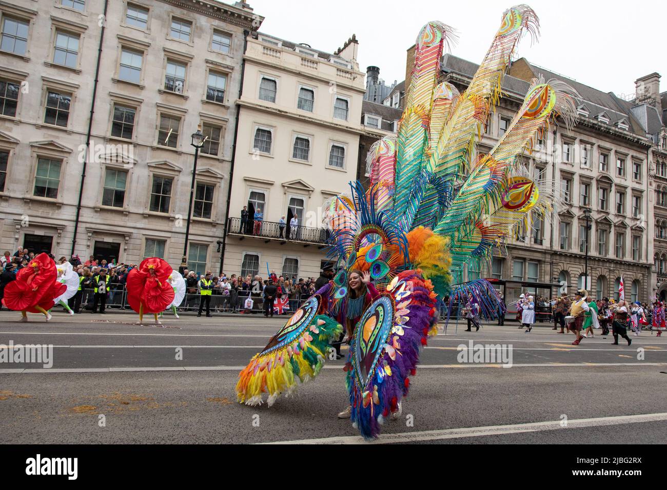 London, UK. 5th June 2022. A woman dressed as a peacock was part of a 7-thousand-people strong Platinum Jubilee Pageant held in central London to mark her Majesty's 70 years on the throne. The colourful parade made its way along Whitehall, the Mall and past Buckingham Palace and was described by many as a once in a lifetime event. Credit: Kiki Streitberger / Alamy Live News Stock Photo