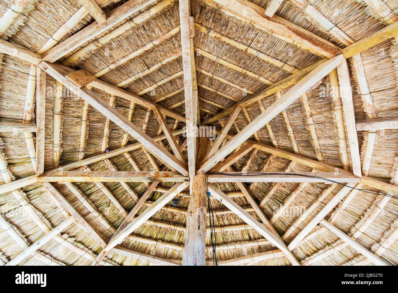 Underside of a wooden beach side hut made with nipa palm roofing in Basilan, Philippines Stock Photo