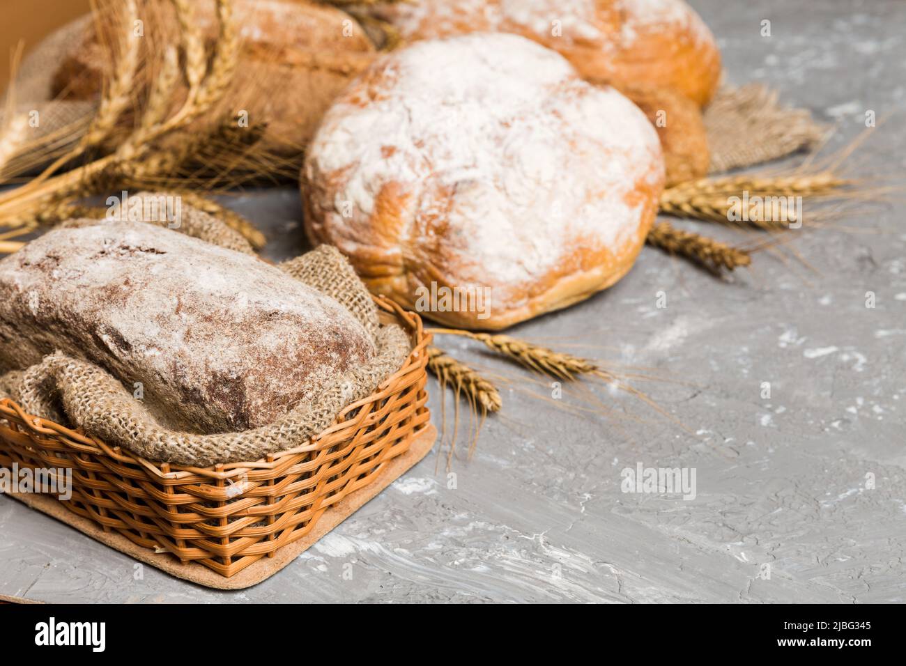 Homemade natural breads. Different kinds of fresh bread as background, perspective view with