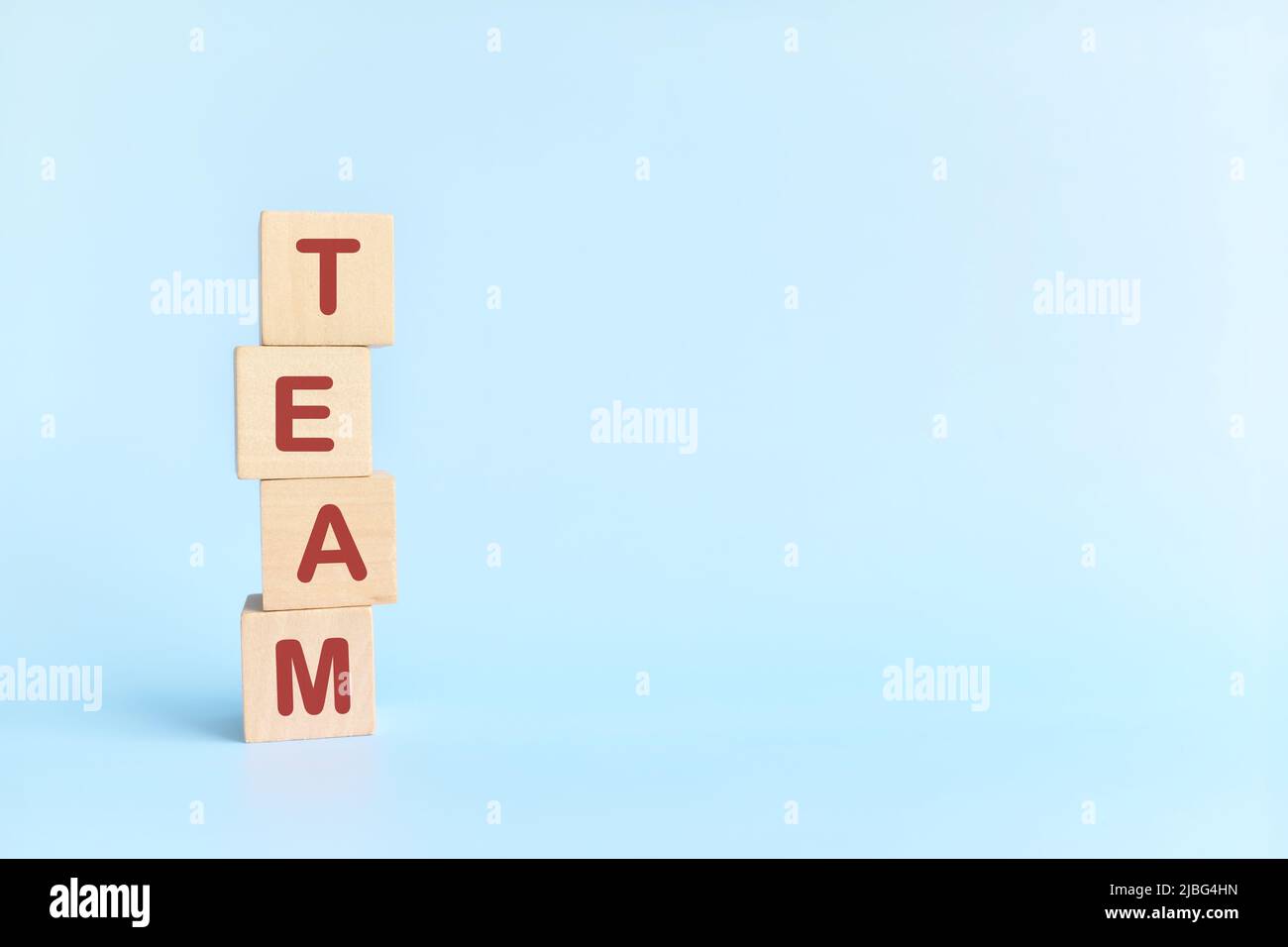 Team building and teamwork concept. Human hand stacking wooden blocks