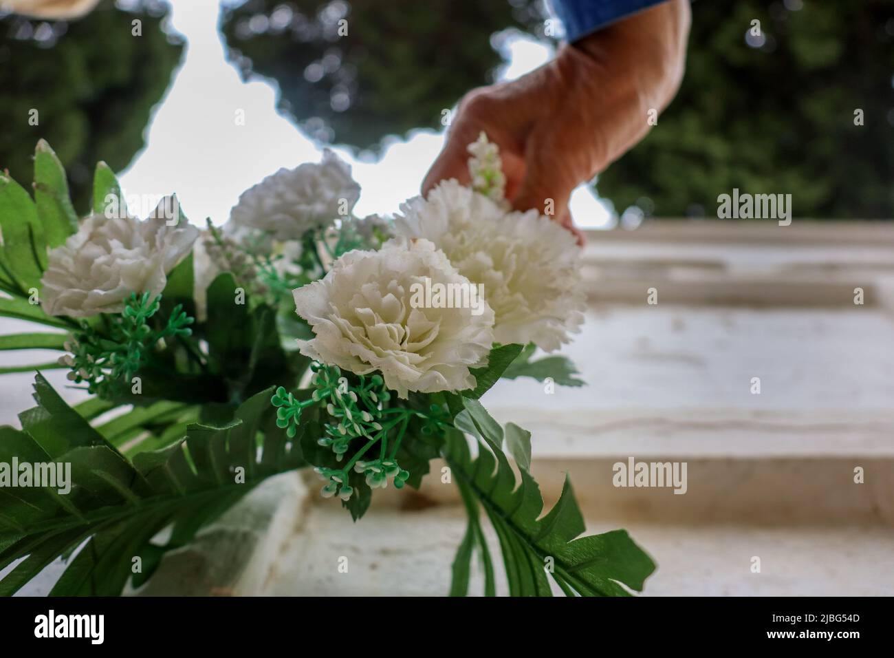 arrange flowers in the cemetery Stock Photo Alamy