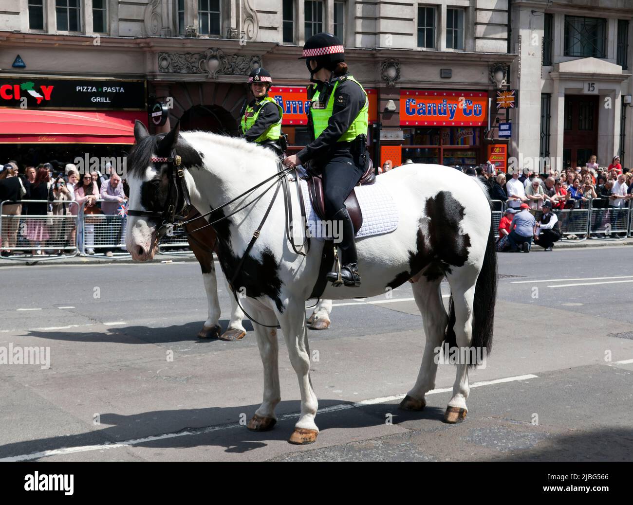 Two mounted Female Police Officers on duty, at the end of the fly-past to celebrate Trooping the Colour: The Queen’s Birthday Parade,  part of  her Platinum Jubilee Celebrations 2022 Stock Photo