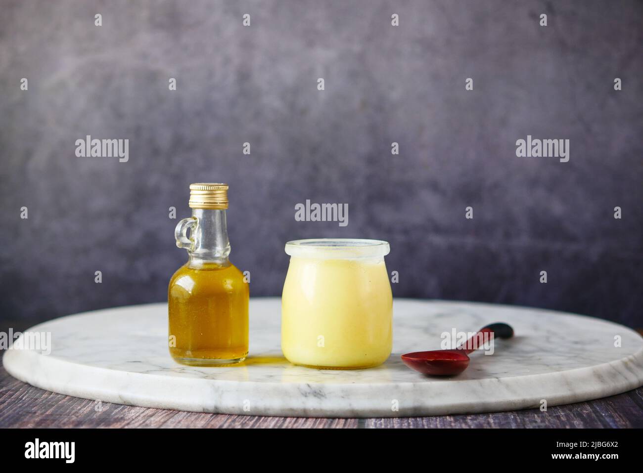 homemade ghee in container on a table Stock Photo Alamy
