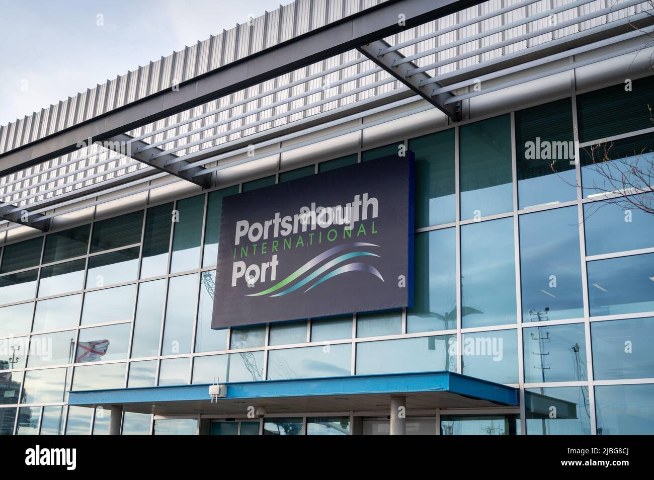 Portsmouth International Port showing buildings, sign at the international ferry terminal and transport hub UK Stock Photo