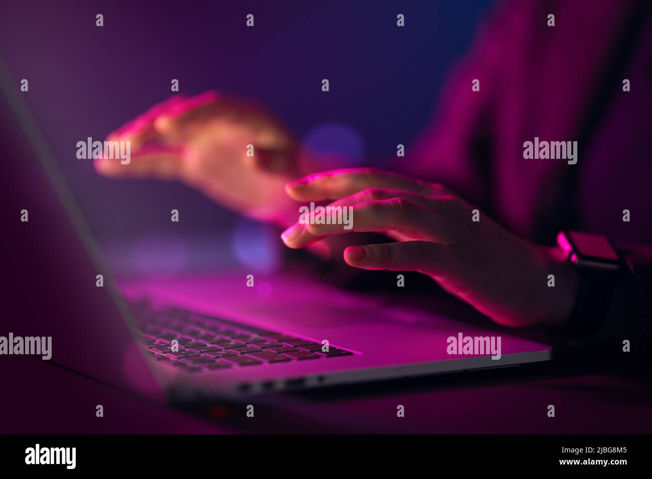 Female manager is using laptop. Computer and hands close up. Stock Photo