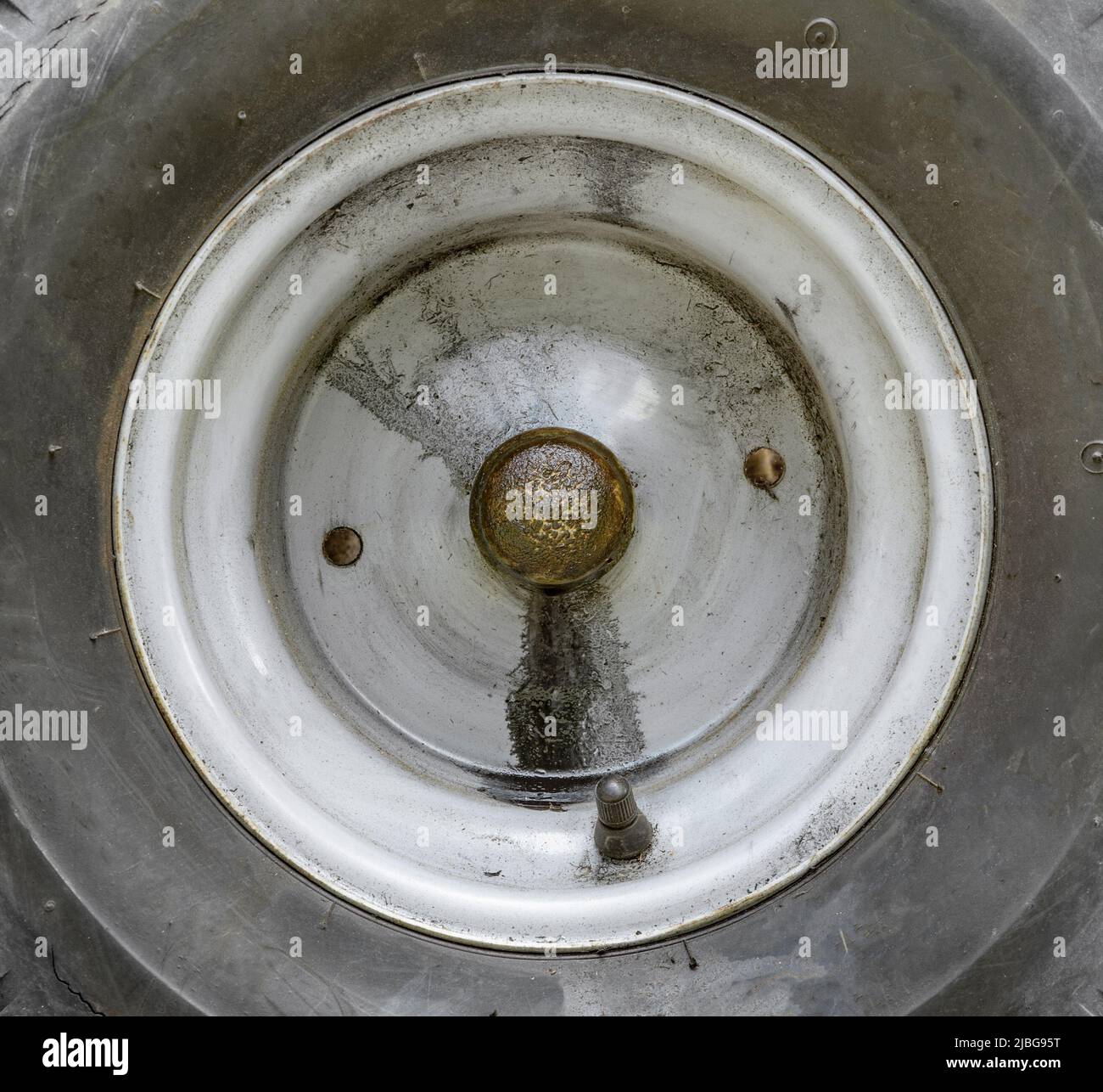 Lawn tractor tire transmission or transaxle fluid leak Stock Photo Alamy