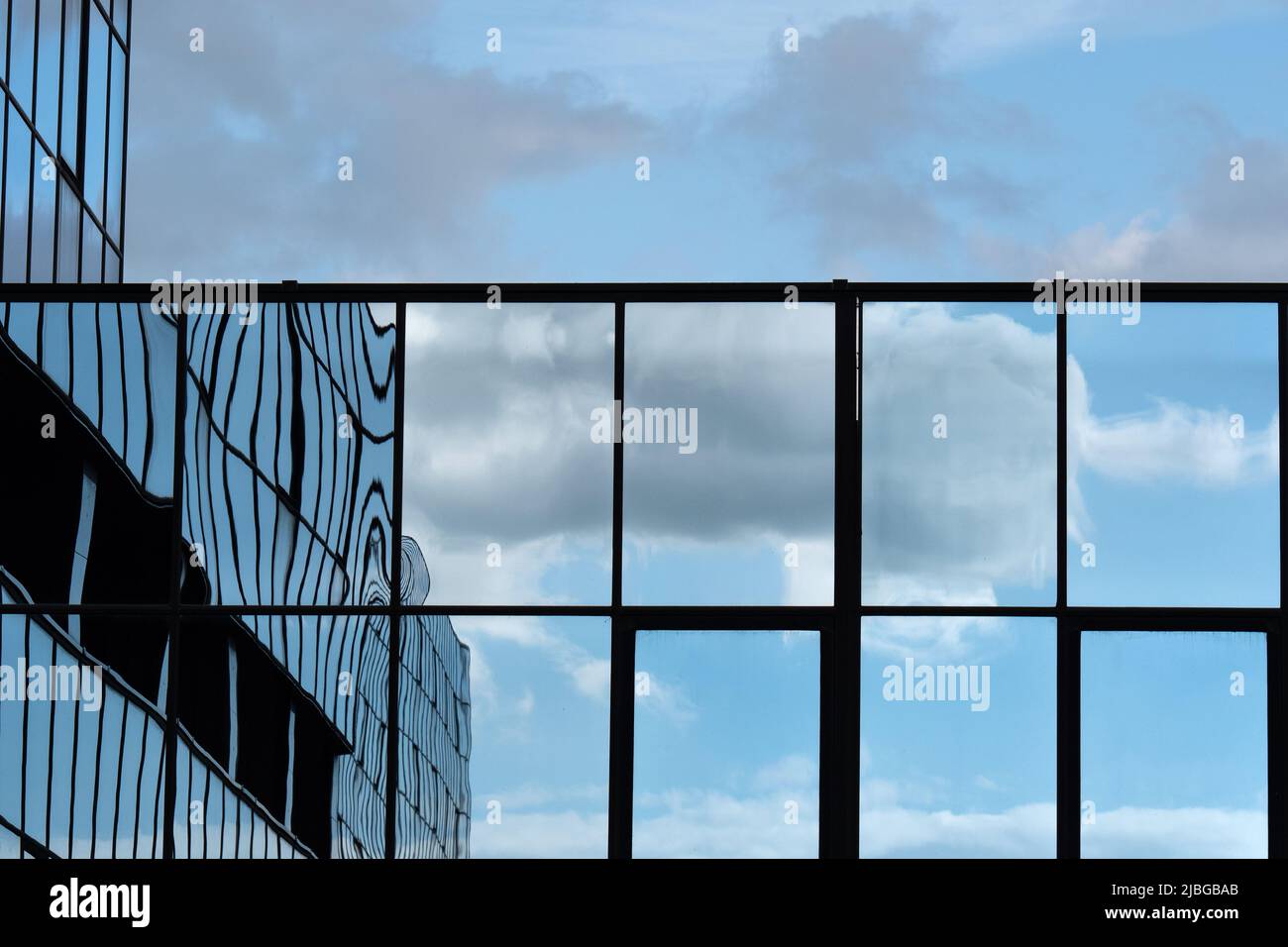 Blue Sky and Clouds Reflected in the Glass Building Stock Photo - Alamy