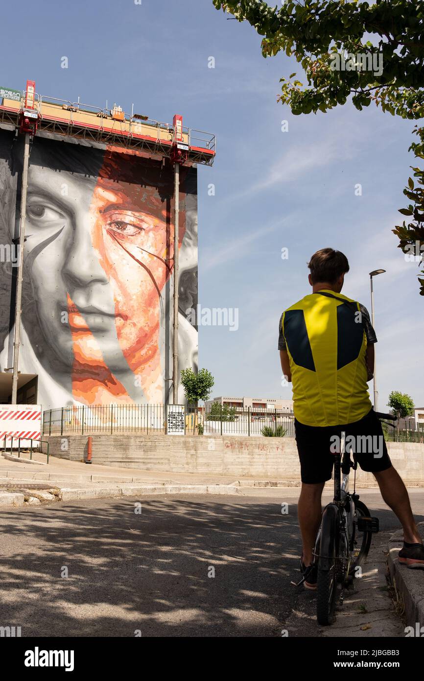 Naples, Italy. 06th June, 2022. Mural made in Scampia by the street artist Jorit in collaboration with Trisha. The latter portrayed Fabrizio De Andrè. The work was created on the occasion of 'Muraria', a festival promoted by the Municipality of Naples with funding from the Metropolitan City. Credit: Independent Photo Agency/Alamy Live News Stock Photo