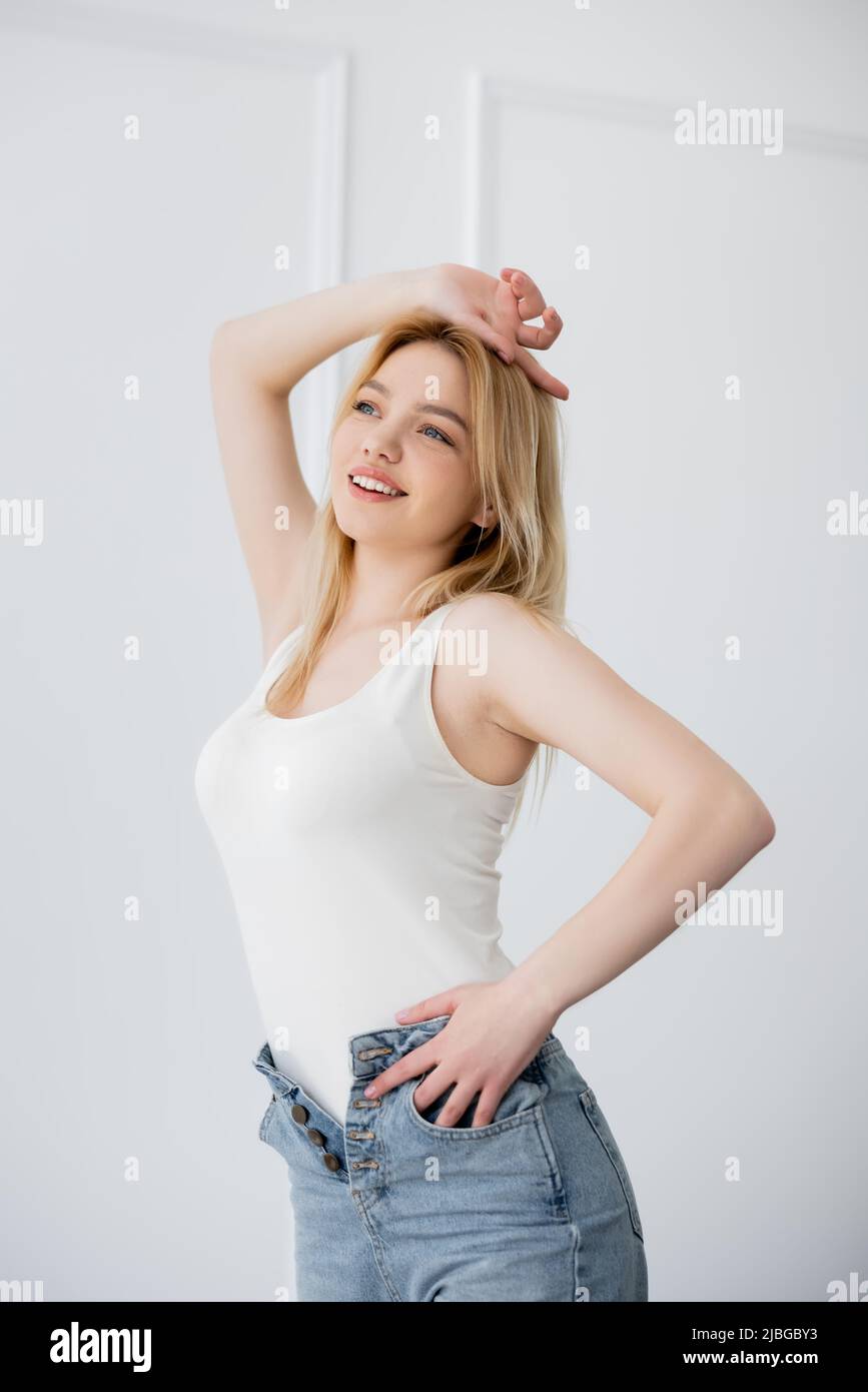 Pretty blonde woman in jeans hi-res stock photography and images - Alamy