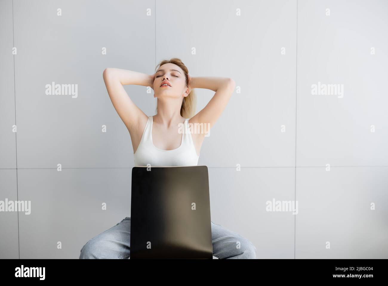 One woman sitting chair eyes closed hi-res stock photography and images ...