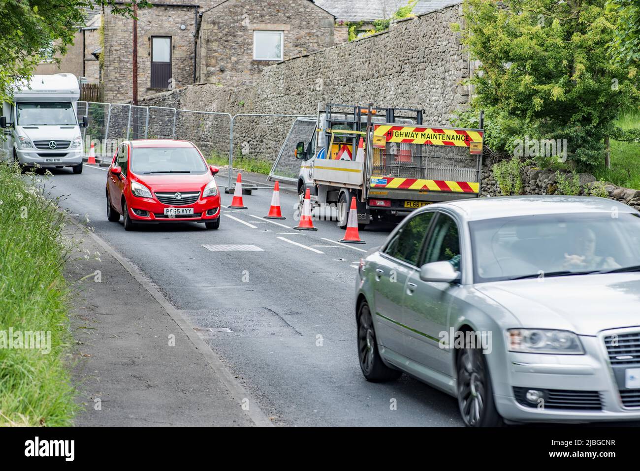 Traffic lights set in place on the A65 at Long Preston for the order of 6 weeks, whilst a tall wall is  to betaken down and rebuilt . Stock Photo
