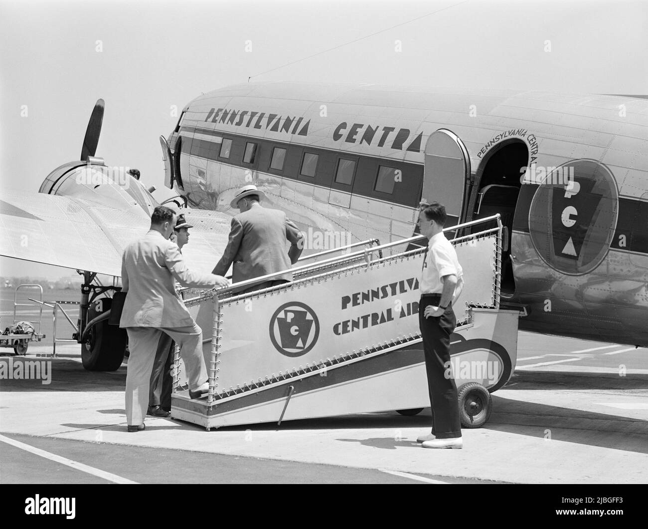 Vintage photo circa 1941 of passengers boarding a Douglas DC3 airliner operated by Pennsylvania Central Airlines at Washington DC Stock Photo