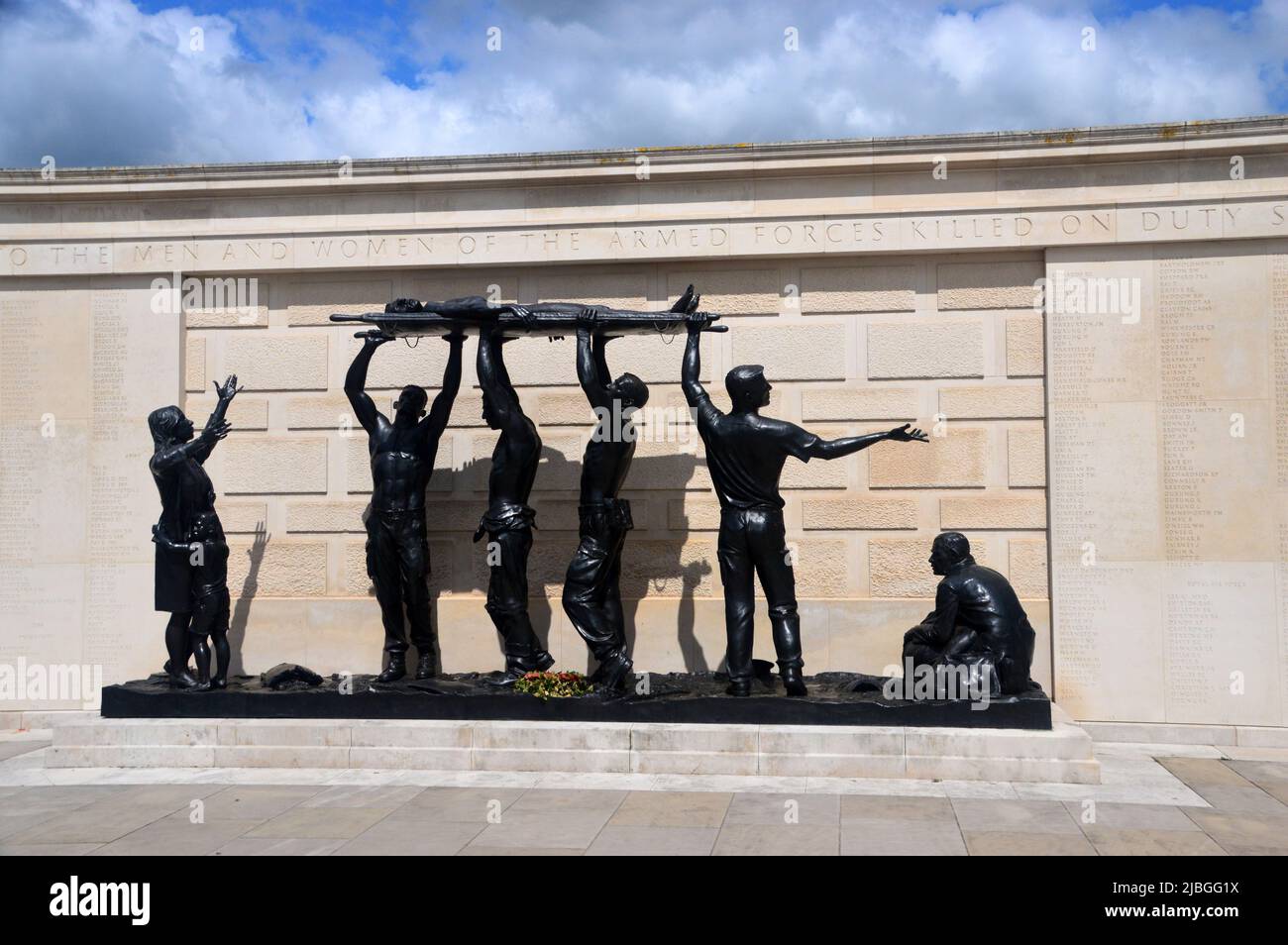 The Armed Forces Memorial with Bronze Statues next to White Portland