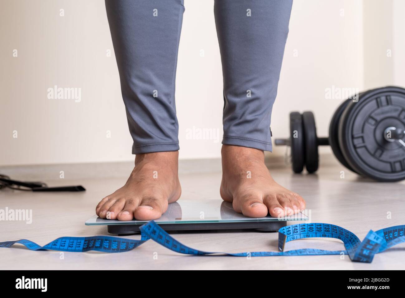 Close up photo of man trying to losing weight by exercising. Stock Photo