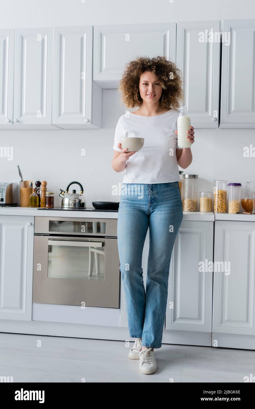Woman kitchen eating jeans hires stock photography and images Alamy