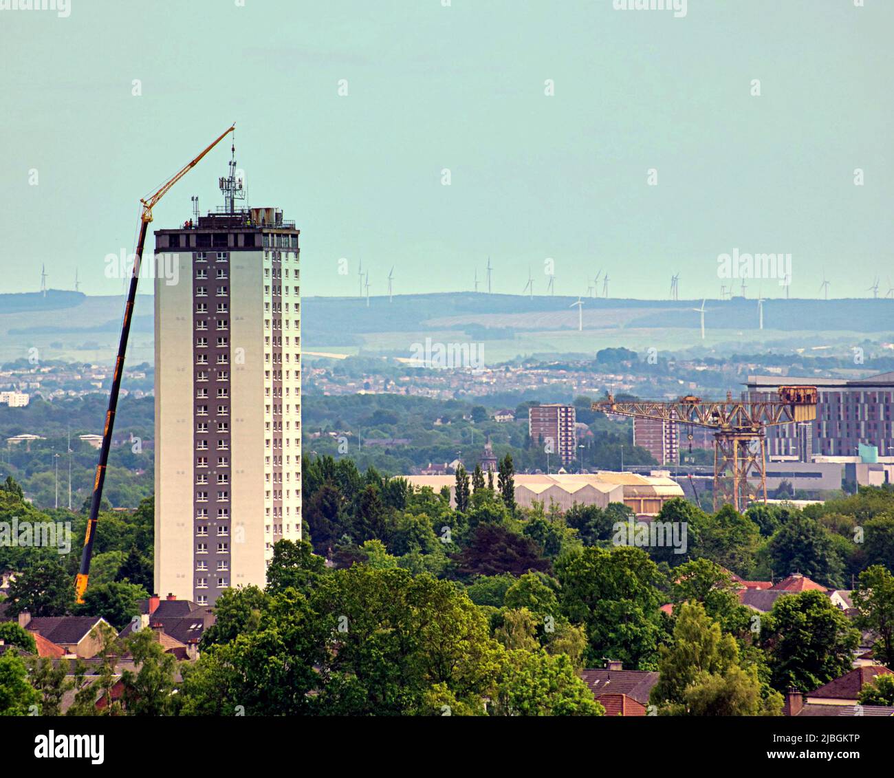 Glasgow, Scotland, UK 6th June, 2022.  Despite the health concerns and the targetting of the poor Scotstoun council towers get 5g aerial installed with the aid of a massive craner. Credit Gerard Ferry/Alamy Live News Stock Photo