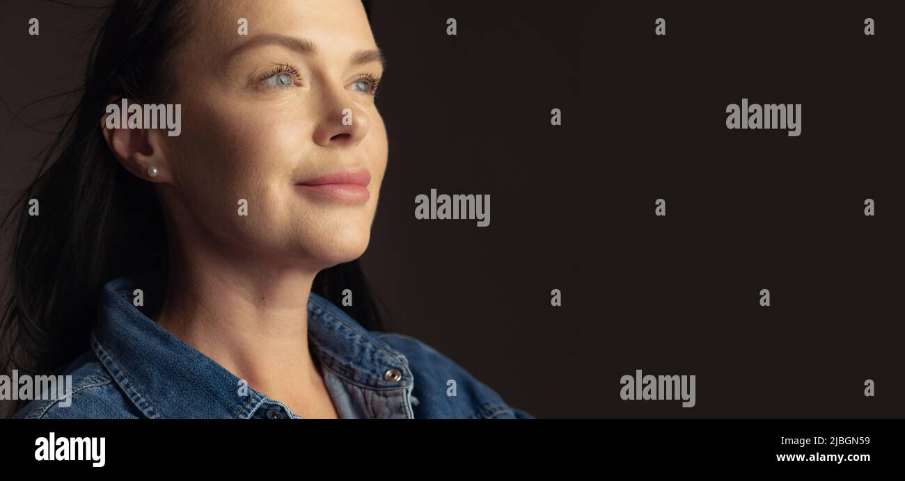 Excited woman in blue shirt hi-res stock photography and images - Alamy