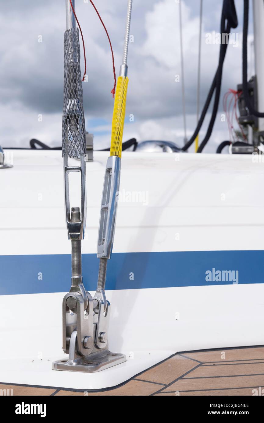 Stainless steel mounting on the side deck of the rigging on a sailing