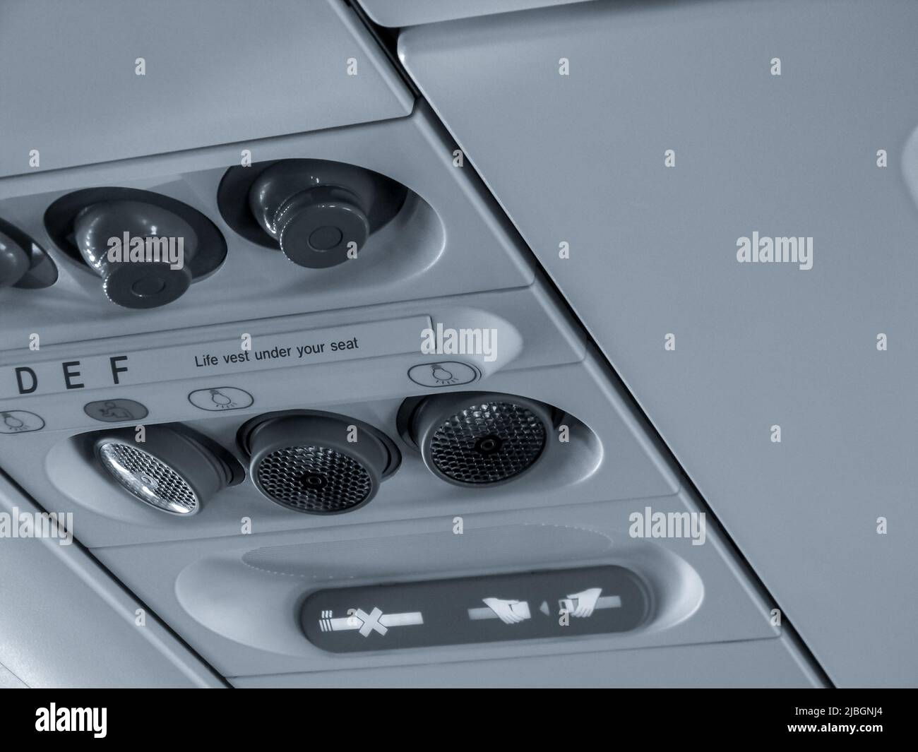 The close up of air conditioner system and sign of seatbelt which