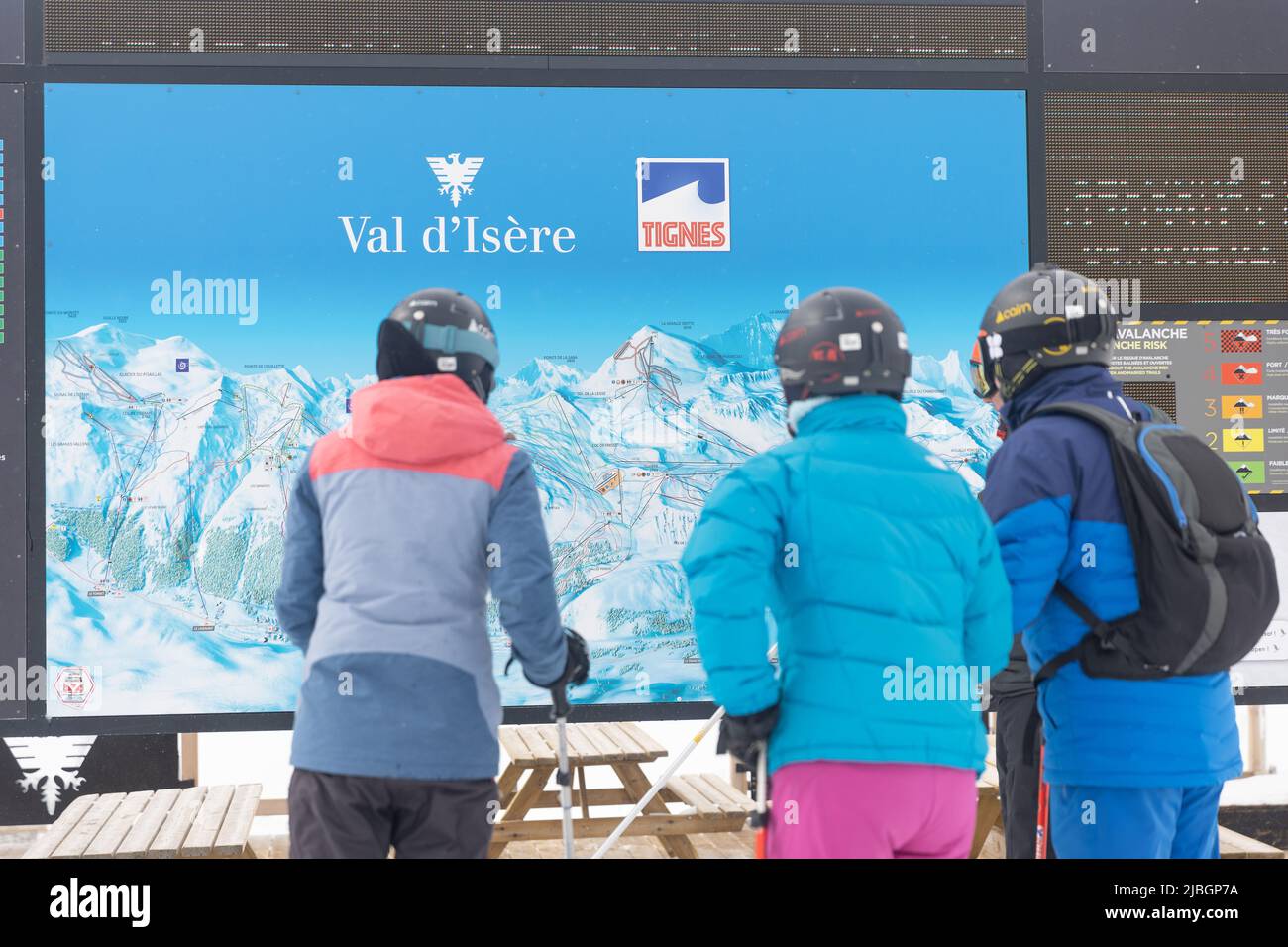 People looking at Piste Map in Val d’Isère Ski Resort in the French Alps Stock Photo