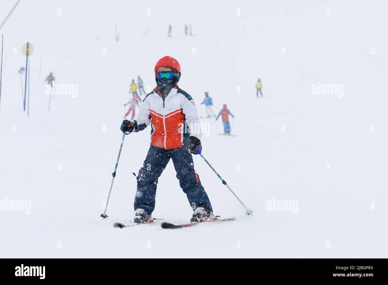 Boy skiing in white out in Val d’Isère Ski Resort in the French Alps Stock Photo