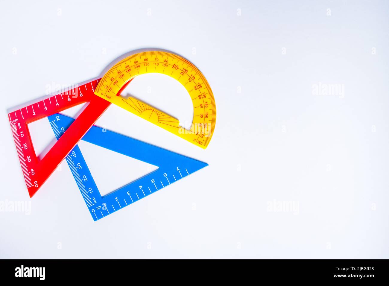 Concept image of colourful rulers and protractor in white background ...