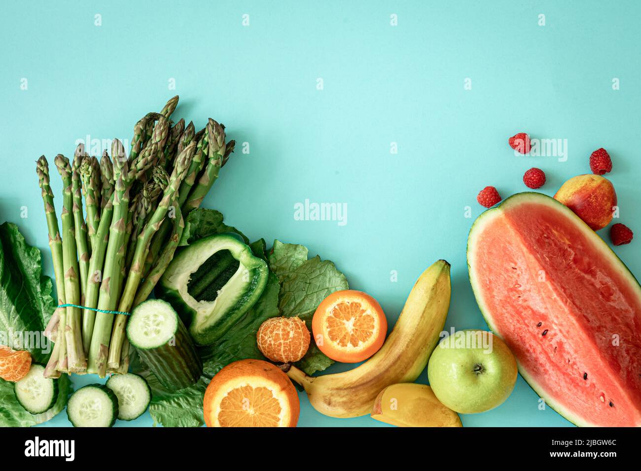 Fruits, berries and vegetables on a blue background Stock Photo - Alamy