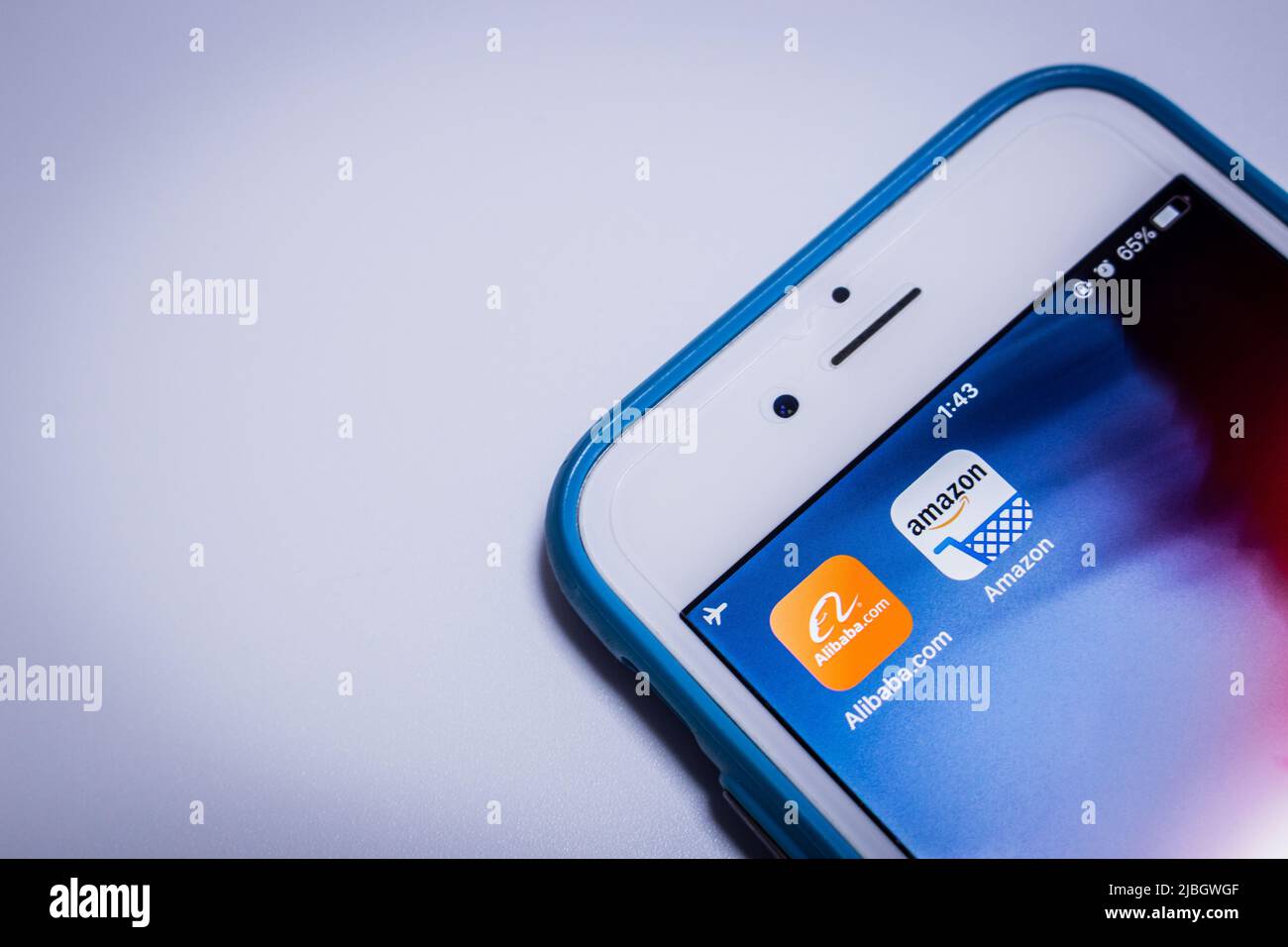 Amazon & Alibaba, 2 big tech giants, on an iPhone. Alibaba is Chinese multinational conglomerate holding company specialised in ecommerce and IT tech. Stock Photo