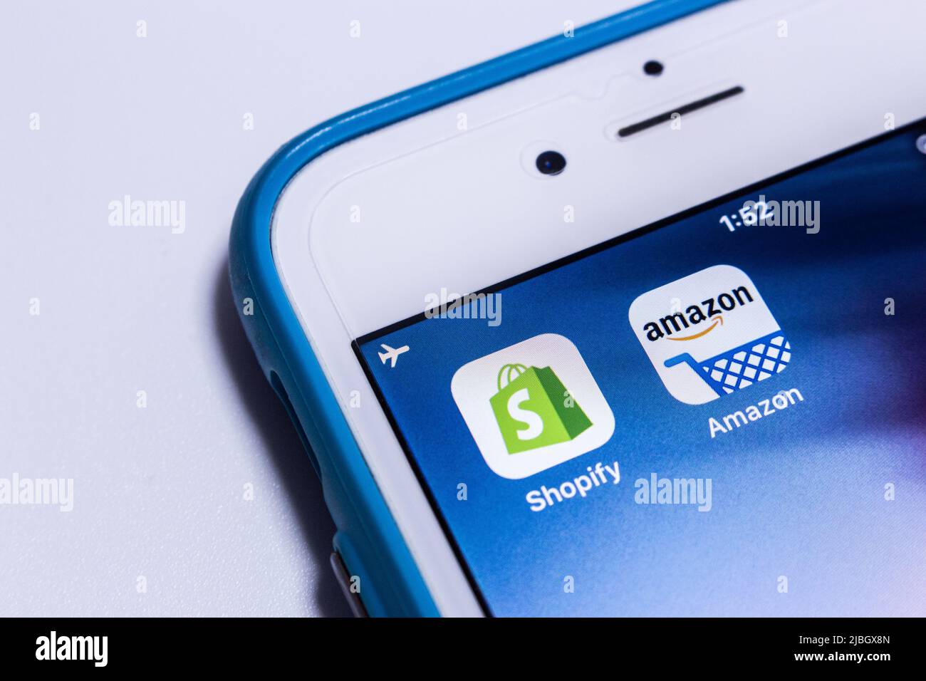 Kumamoto, Japan - Dec 13 2019: Two e-commerce giants Shopify & Amazon on an iPhone. Stock Photo