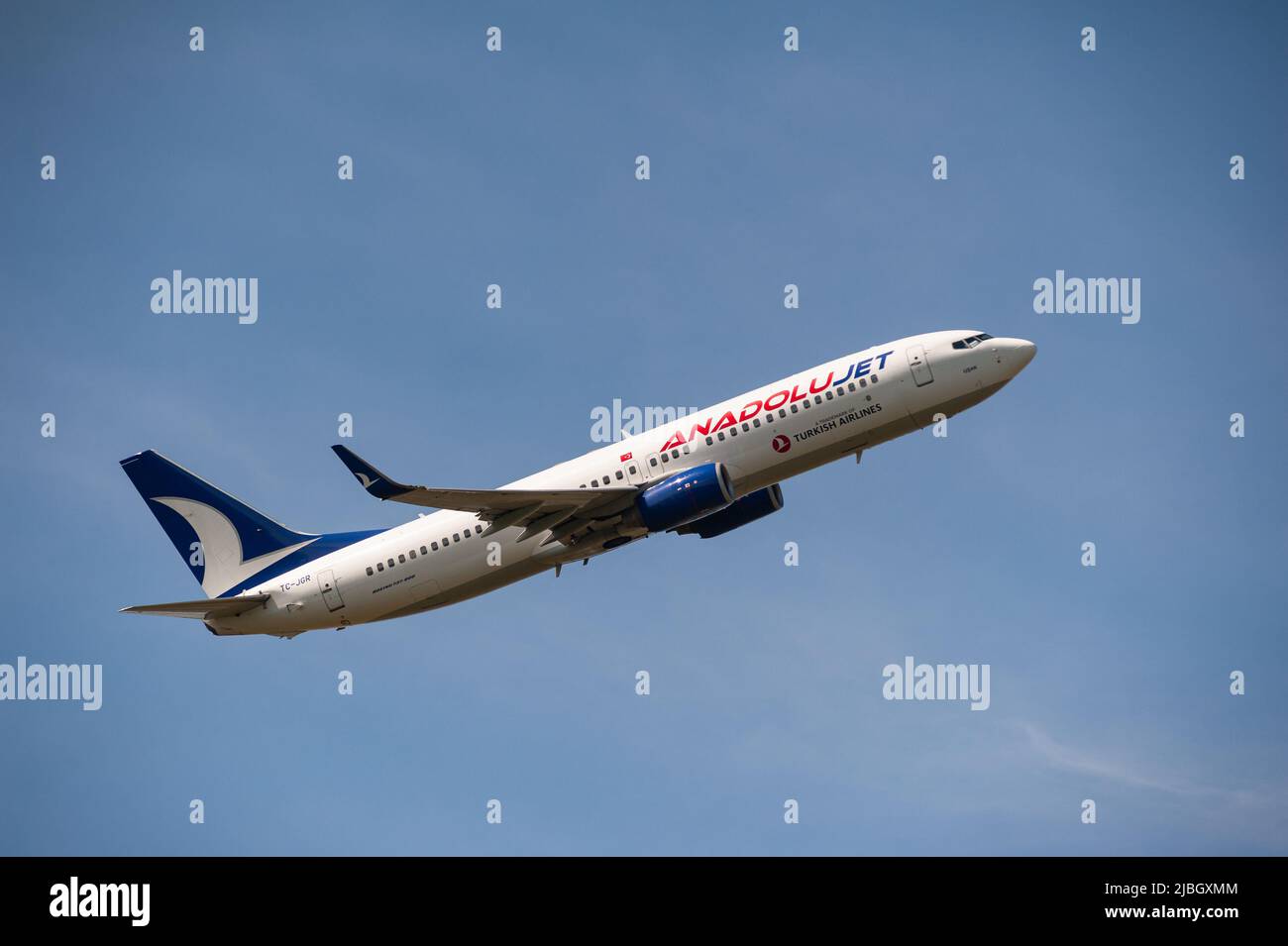 03.06.2022, Berlin, Germany, Europe - An AnadoluJet Boeing 737-800 passenger aircraft takes off from Berlin Brandenburg Airport BER. Stock Photo