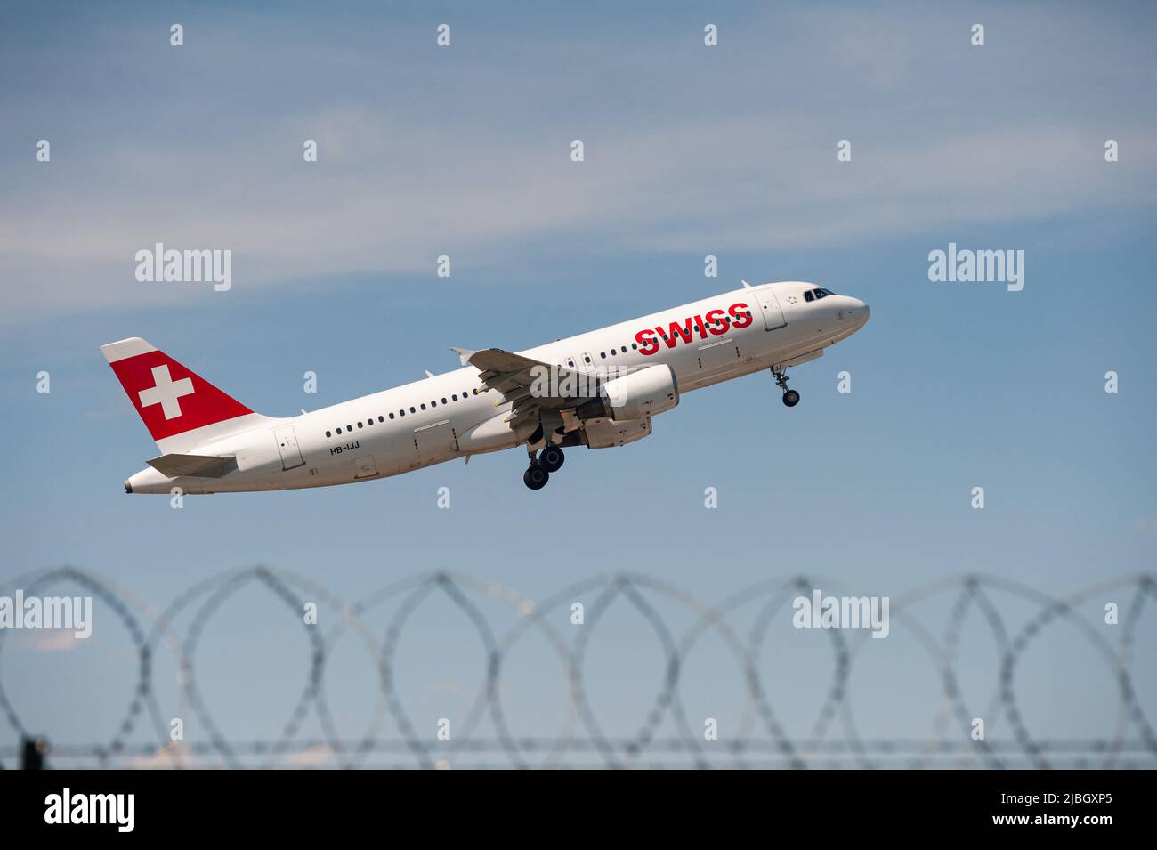 03.06.2022, Berlin, Germany, Europe - A Swiss Airlines Airbus A320 passenger aircraft takes off from Berlin Brandenburg Airport BER. Stock Photo
