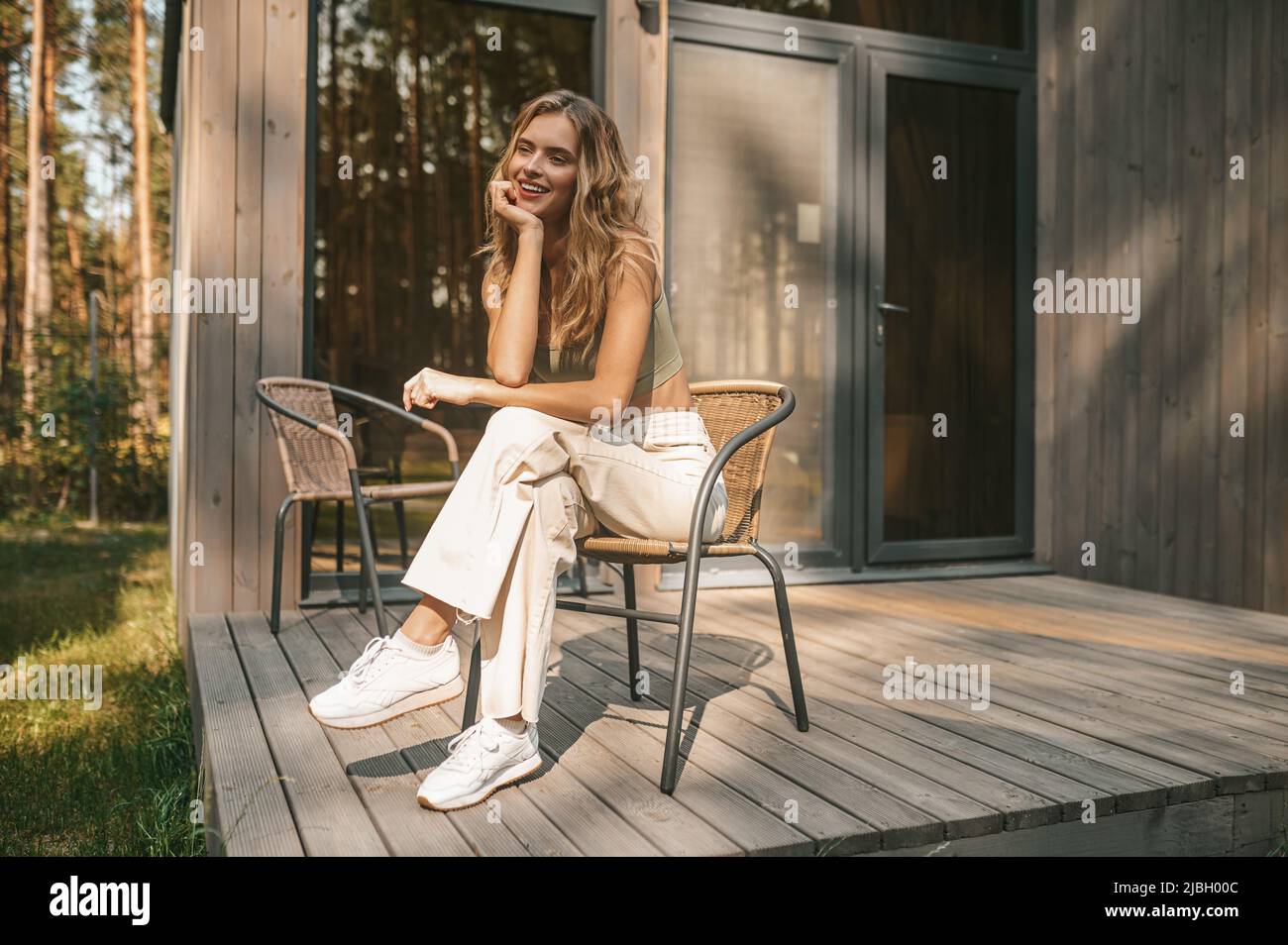 Lady on porch hi-res stock photography and images - Alamy