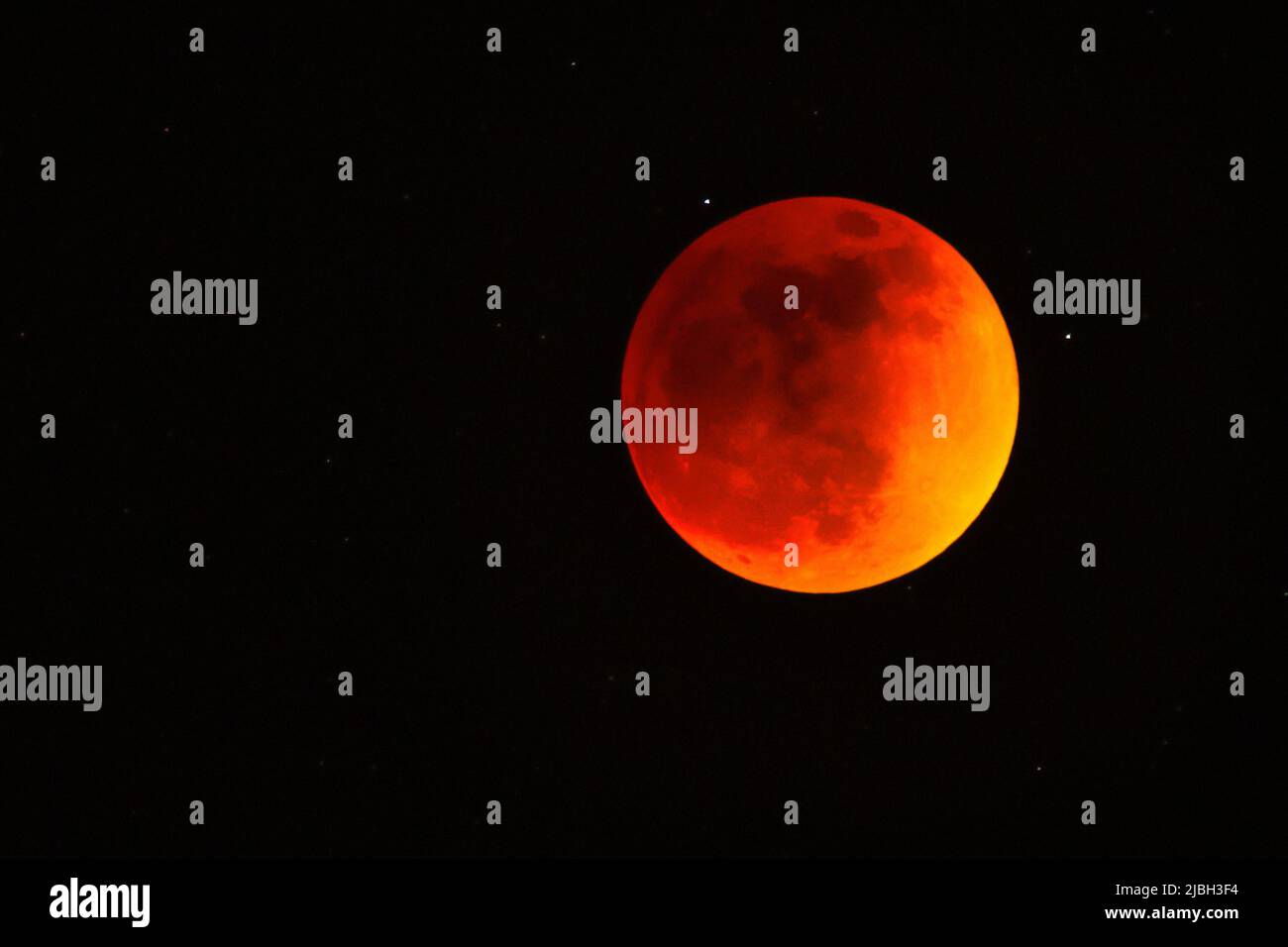 Red moon during total Lunar Eclipse in May 2022 Stock Photo