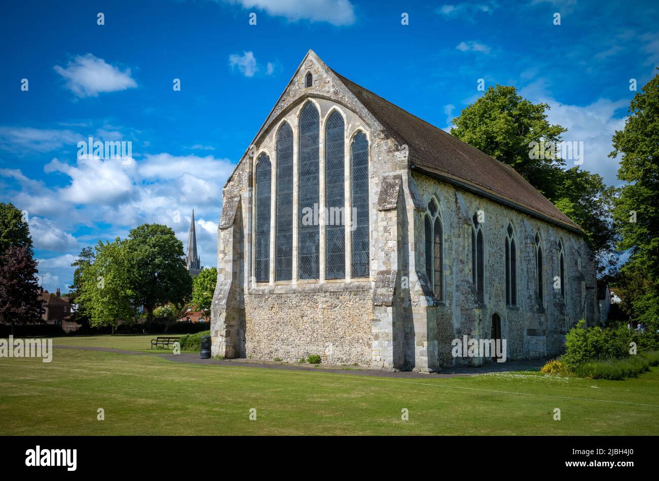 The ancient Guildhall in Chichester's Priory Park with the spire of Chichester Cathedral rising in the distance.. Stock Photo