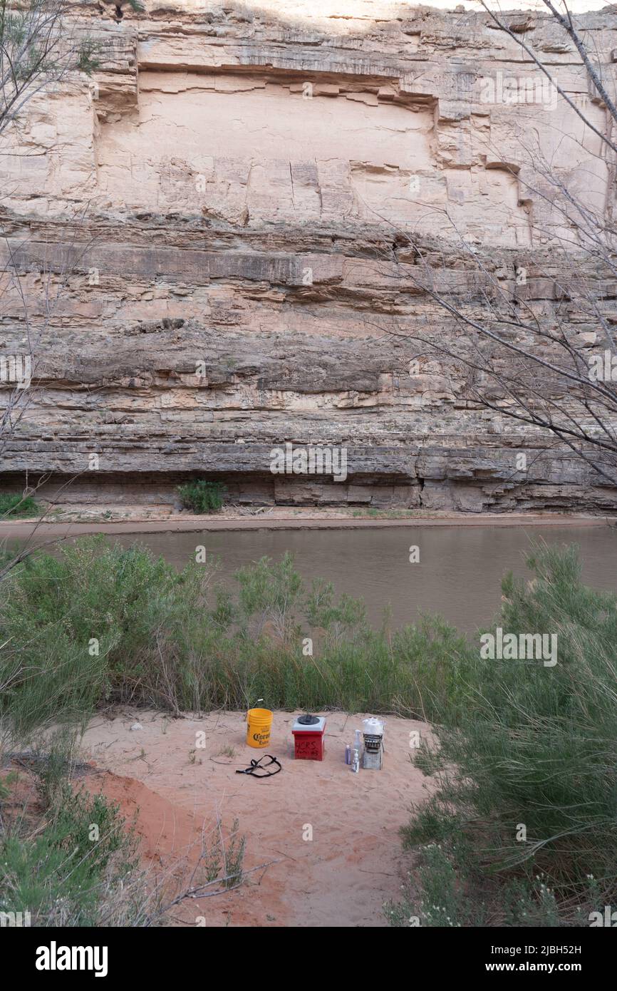An outdoor toilet called a groover is set up along the banks of the San Juan River in southern Utah for a river expedition. Stock Photo
