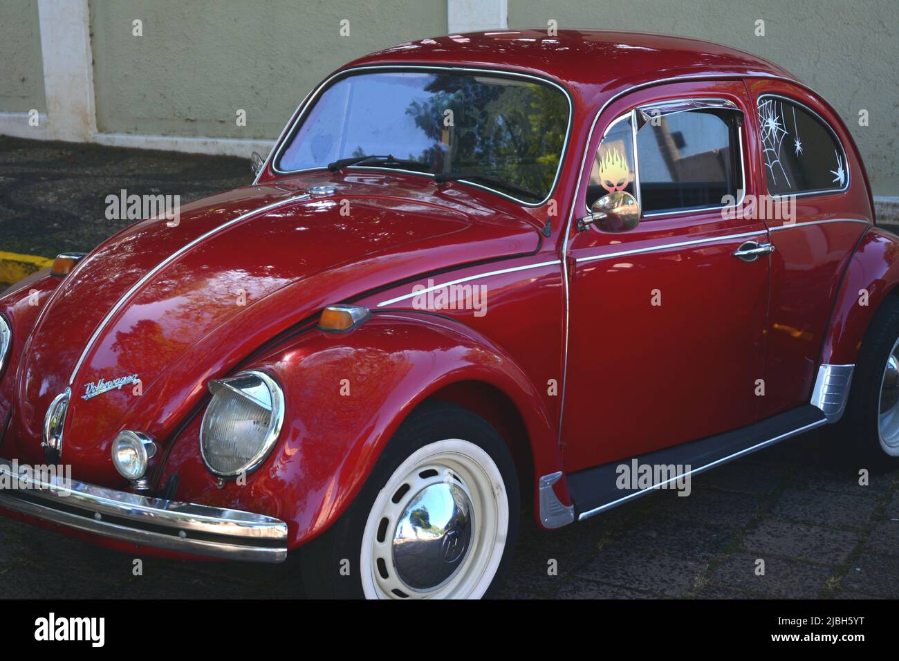 Vintage Volkswagen car on exhibition of vintage cars in Brazil, South America in zoom photo, side, with mile marker, red color Stock Photo