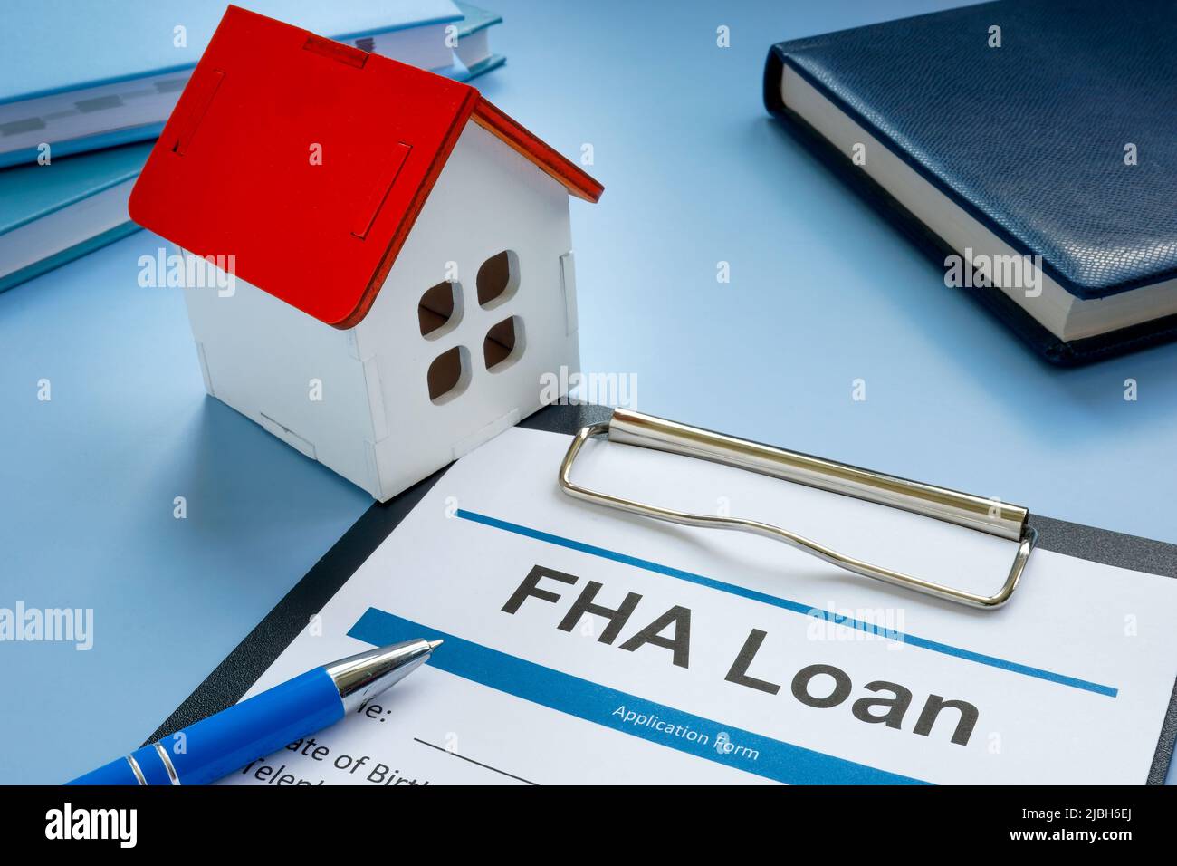 FHA loan application and model of home Stock Photo Alamy