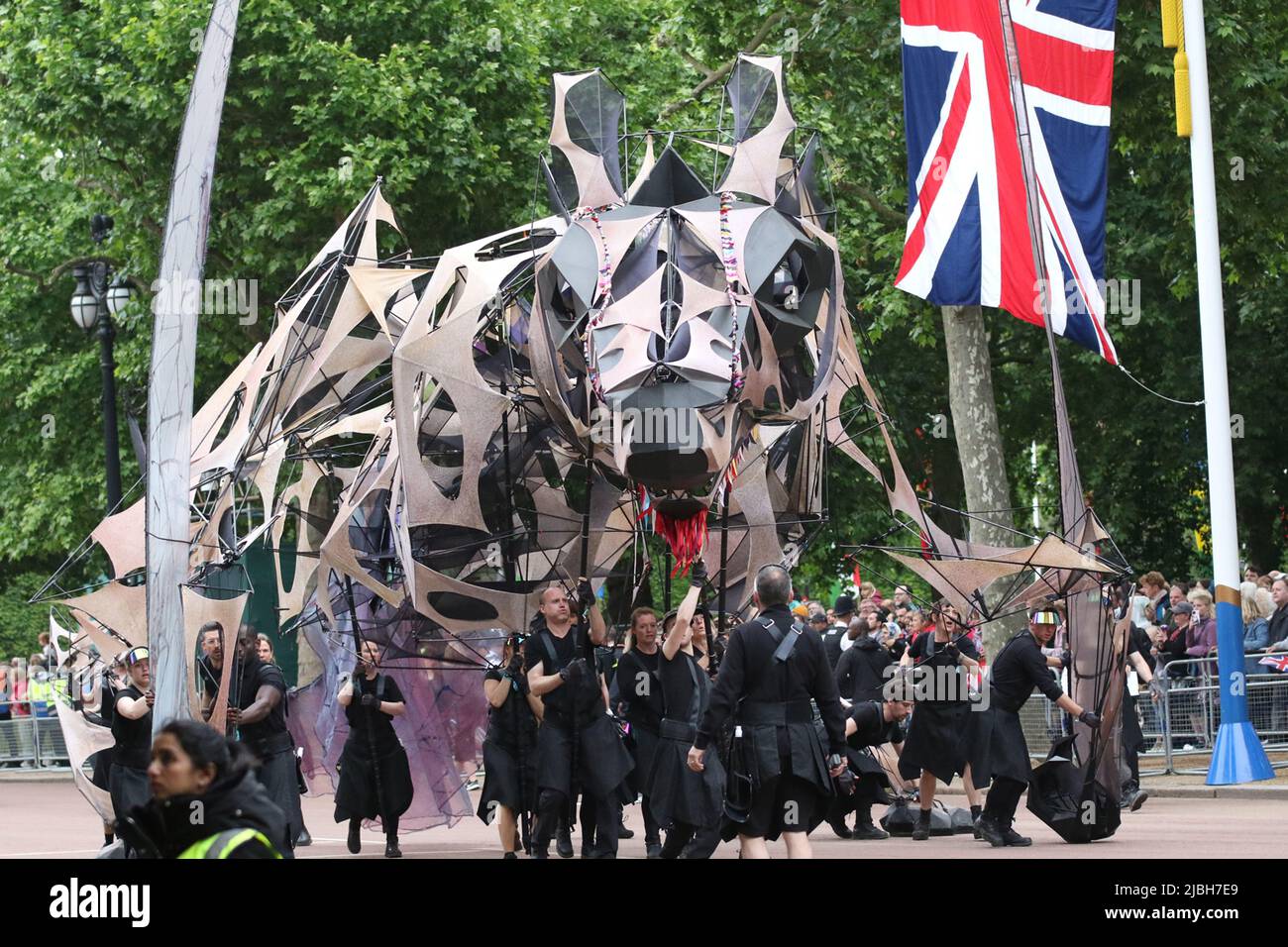 The Hatchling, a giant dragon that is part puppet, part kite on parade