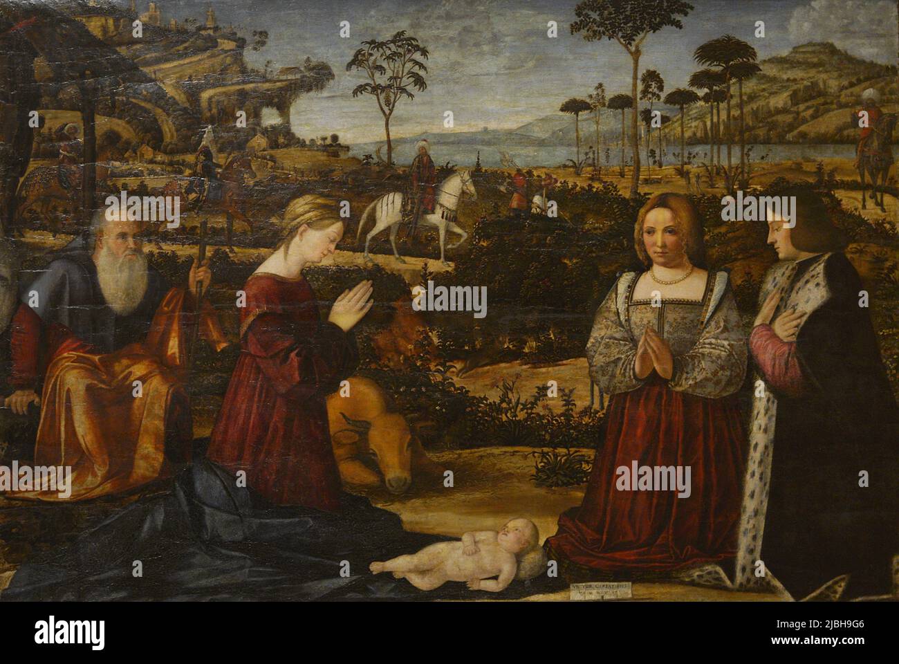 Vittore Carpaccio (ca.1460-1525/1526). Italian painter. Holy Family with Donors, 1505. Tempera and oil (?) on wood. Calouste Gulbenkian Museum. Lisbon, Portugal. Stock Photo