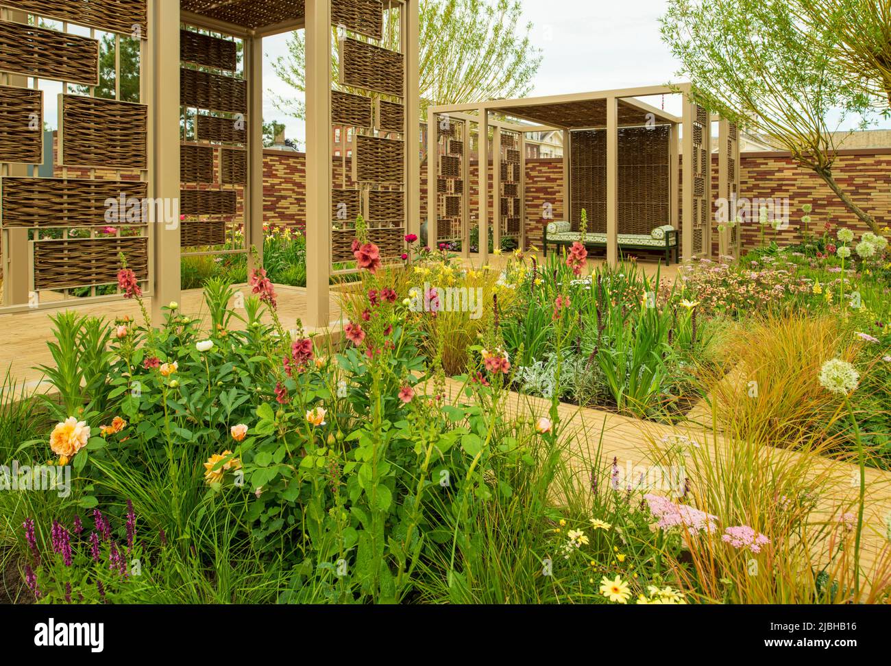 Colourful borders between walkways and pavilions in the Stitchers’ Garden designed by Fredric Whyte. Stock Photo