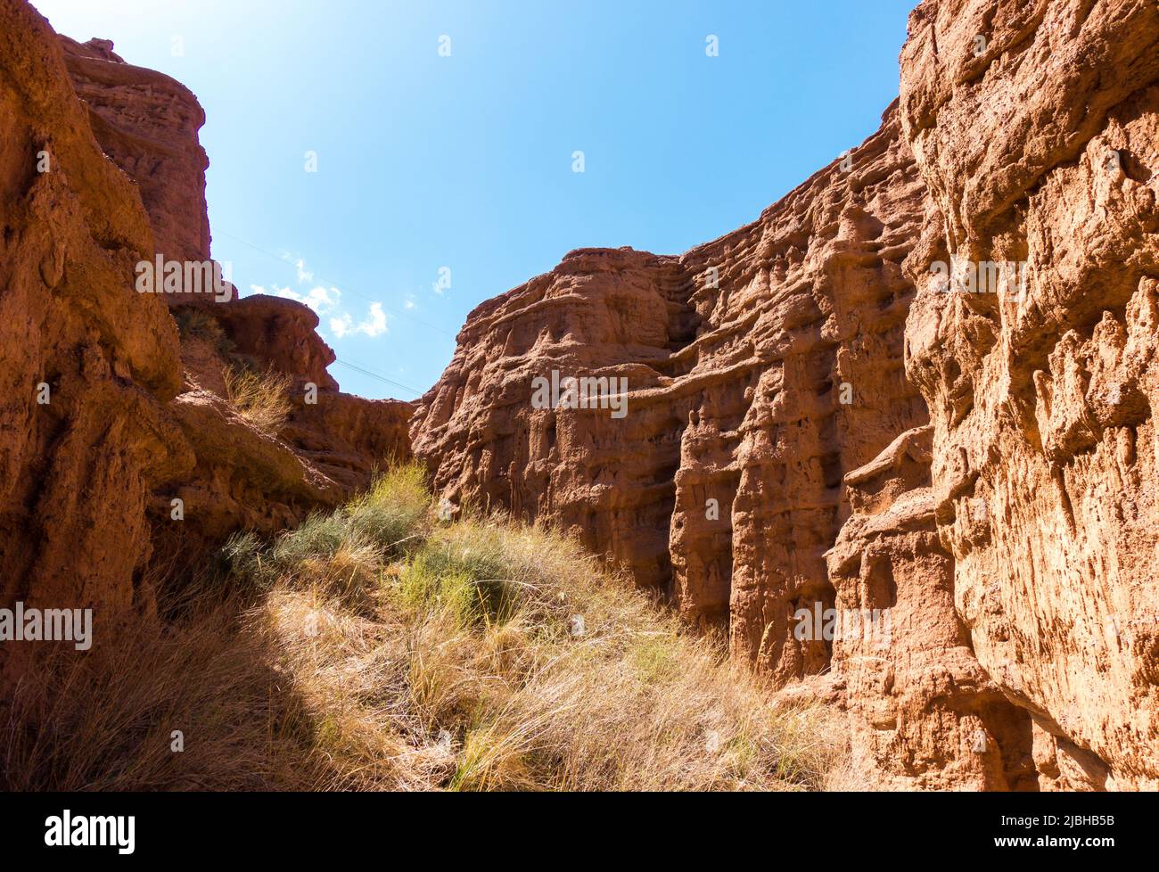 Red rocks and a passage between rocks. Clay canyons. Issyk-Kul region