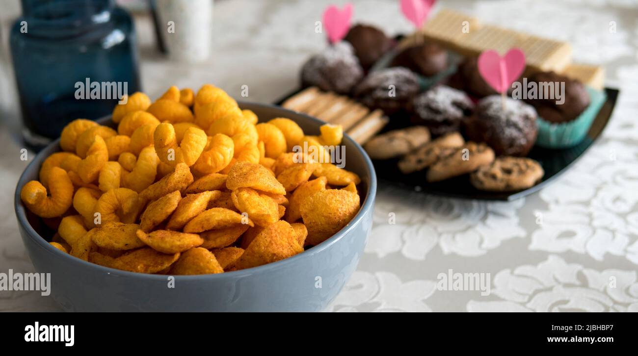 different types of chips in a bowl at a home party Stock Photo