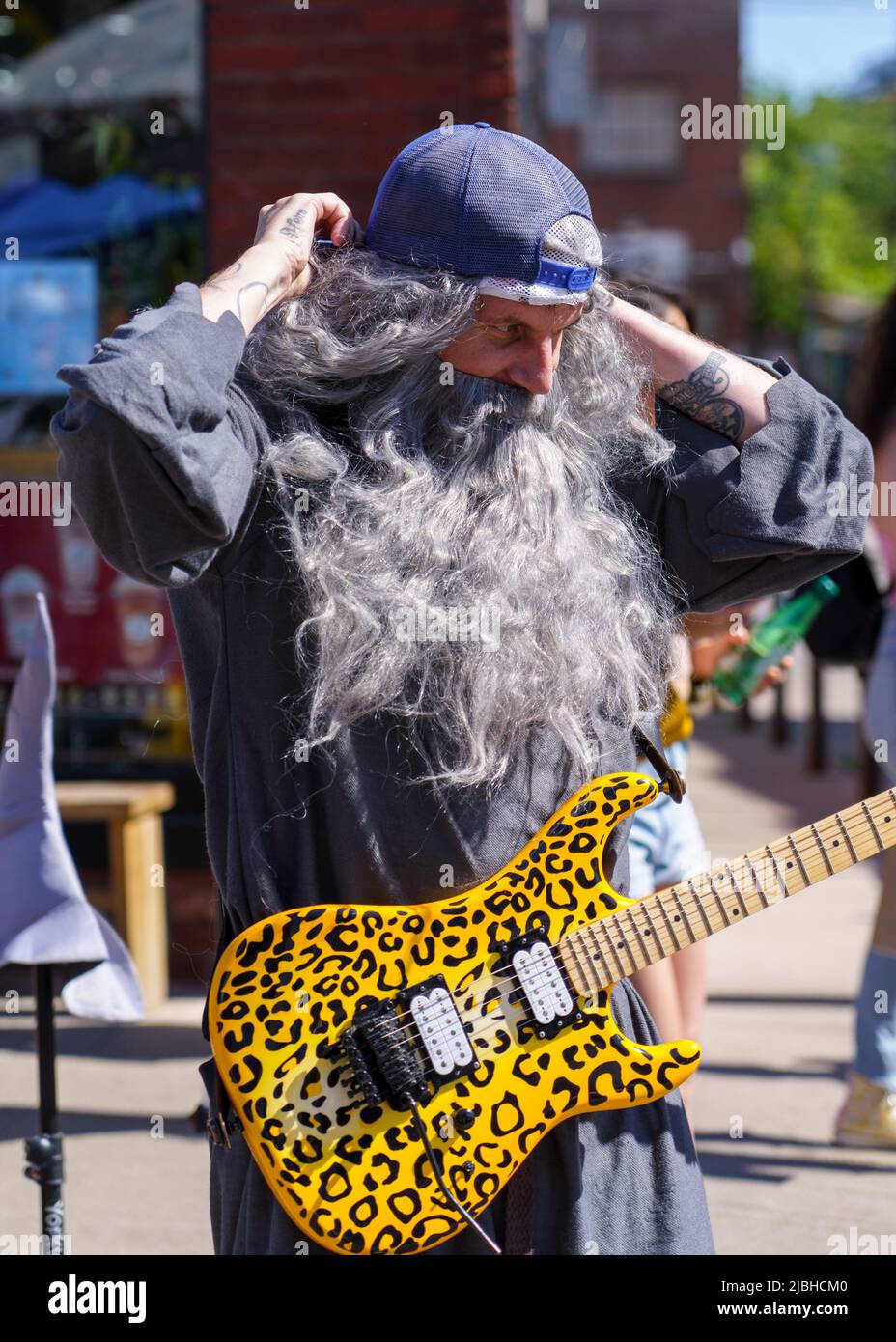 A man in stage clothes performs in Dundas St. West during the Do West Festival. Stock Photo