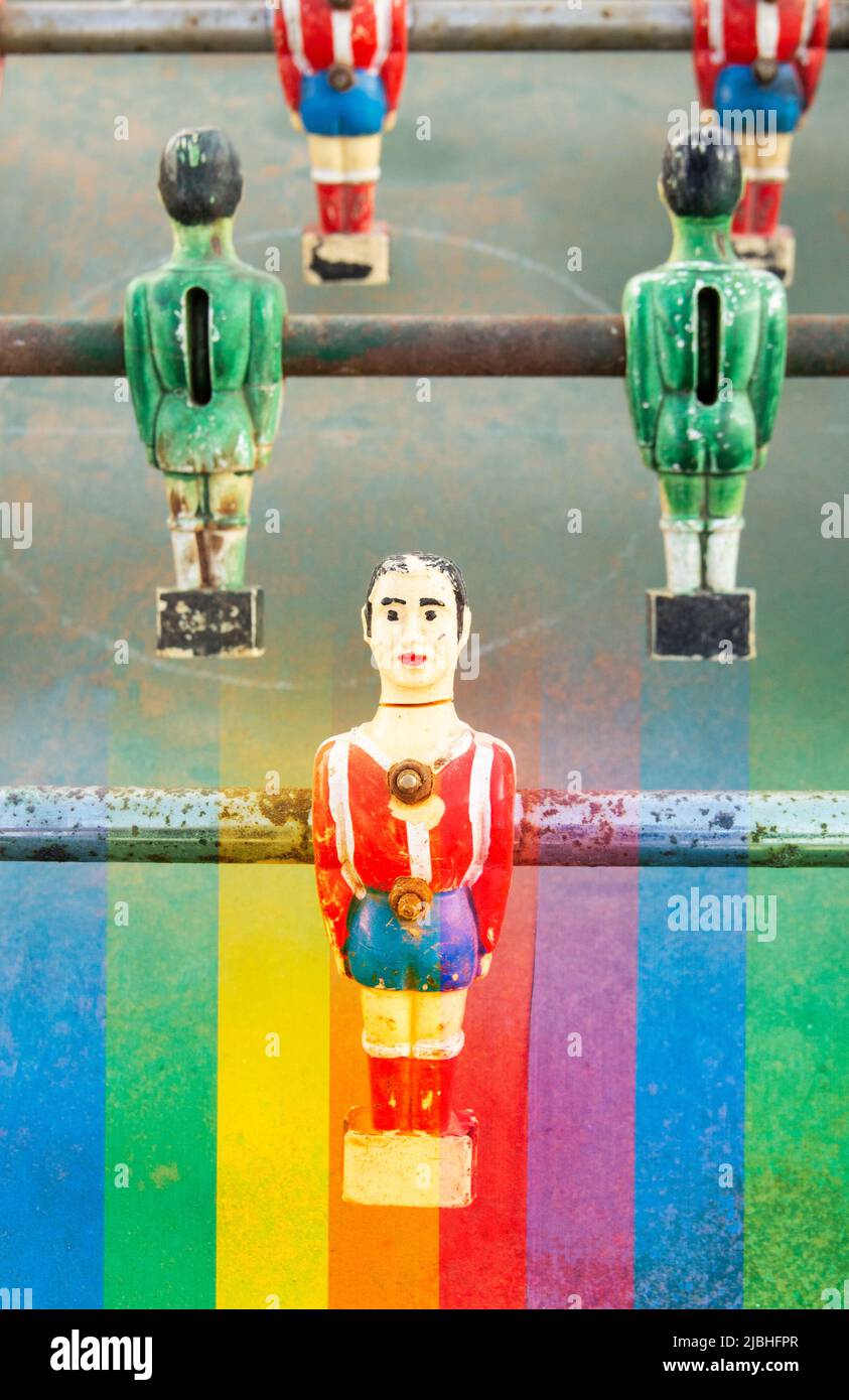 Rainbow flag and table football game composite. LGBTQ, gay footballer, sport, FIFA World Cup, Qatar, equal rights...  concept Stock Photo