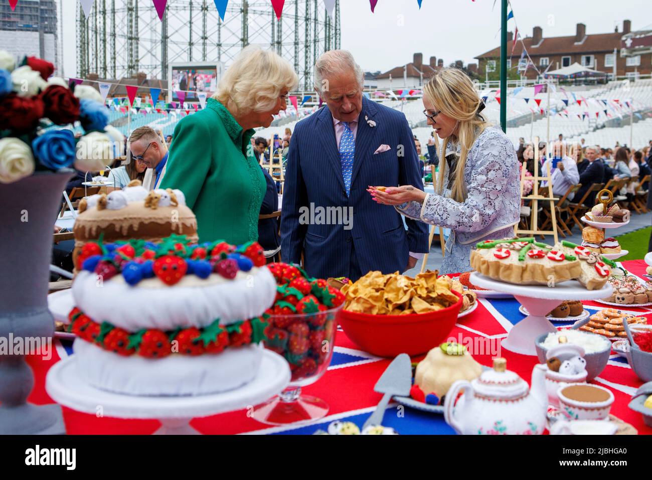 The Prince of Wales and The Duchess of Cornwall view a 6 x 1.5m felt art piece by Lucy Sparrow, of a Jubilee Lunch featuring the Platinum Pudding, sco Stock Photo