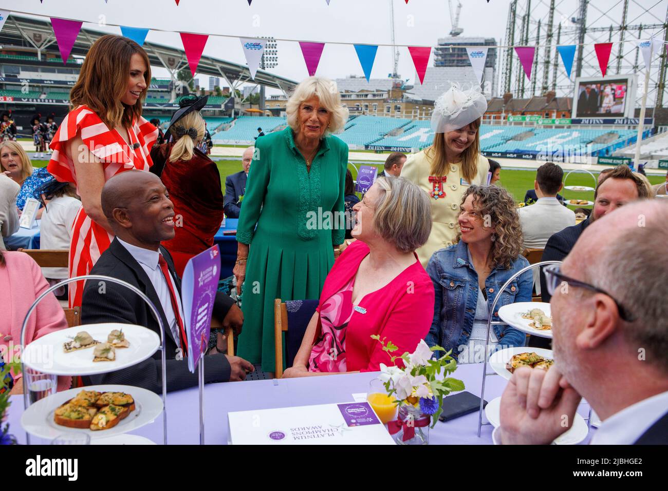 The Duchess of Cornwall meets guests alongside The One Show Television presenter Alex Jones (Charlotte Alexandra Jones) at the Big Lunch on the cricke Stock Photo