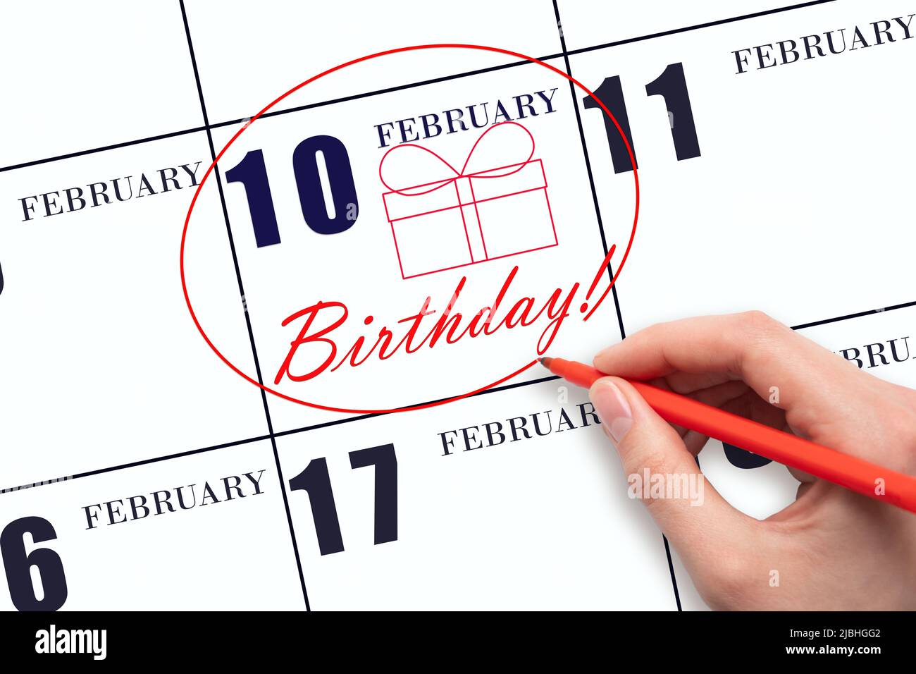 10th day of February. The hand circles the date on the calendar 10