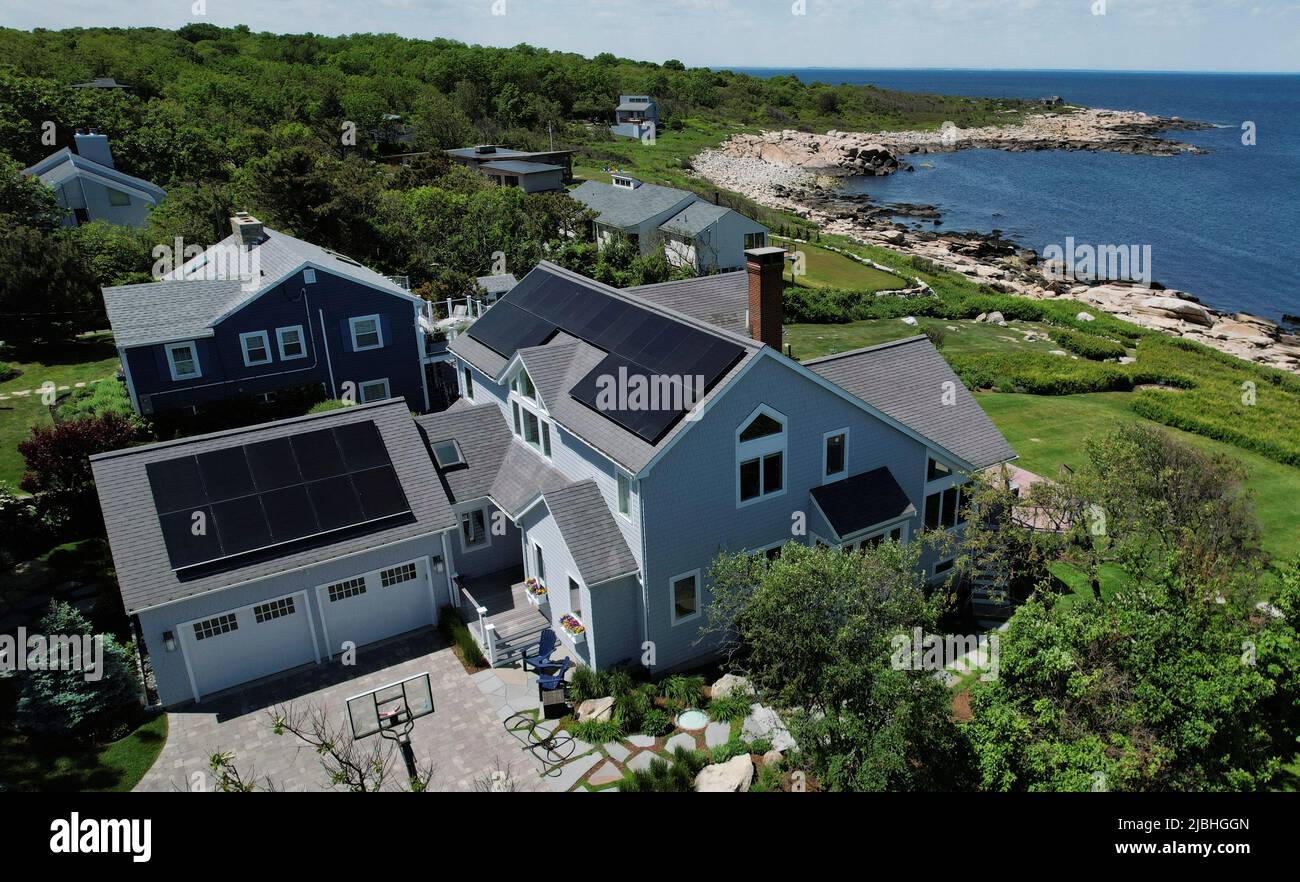 Solar panels create electricity on the roof of a house in Rockport, Massachusetts, U.S., June 6, 2022. Picture taken with a drone.    REUTERS/Brian Snyder Stock Photo