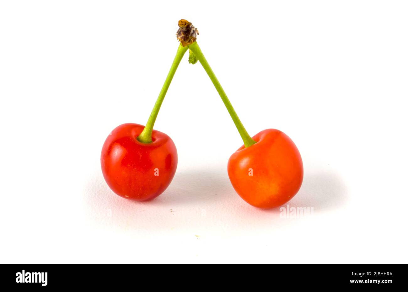 Red cherries isolated on white Stock Photo Alamy